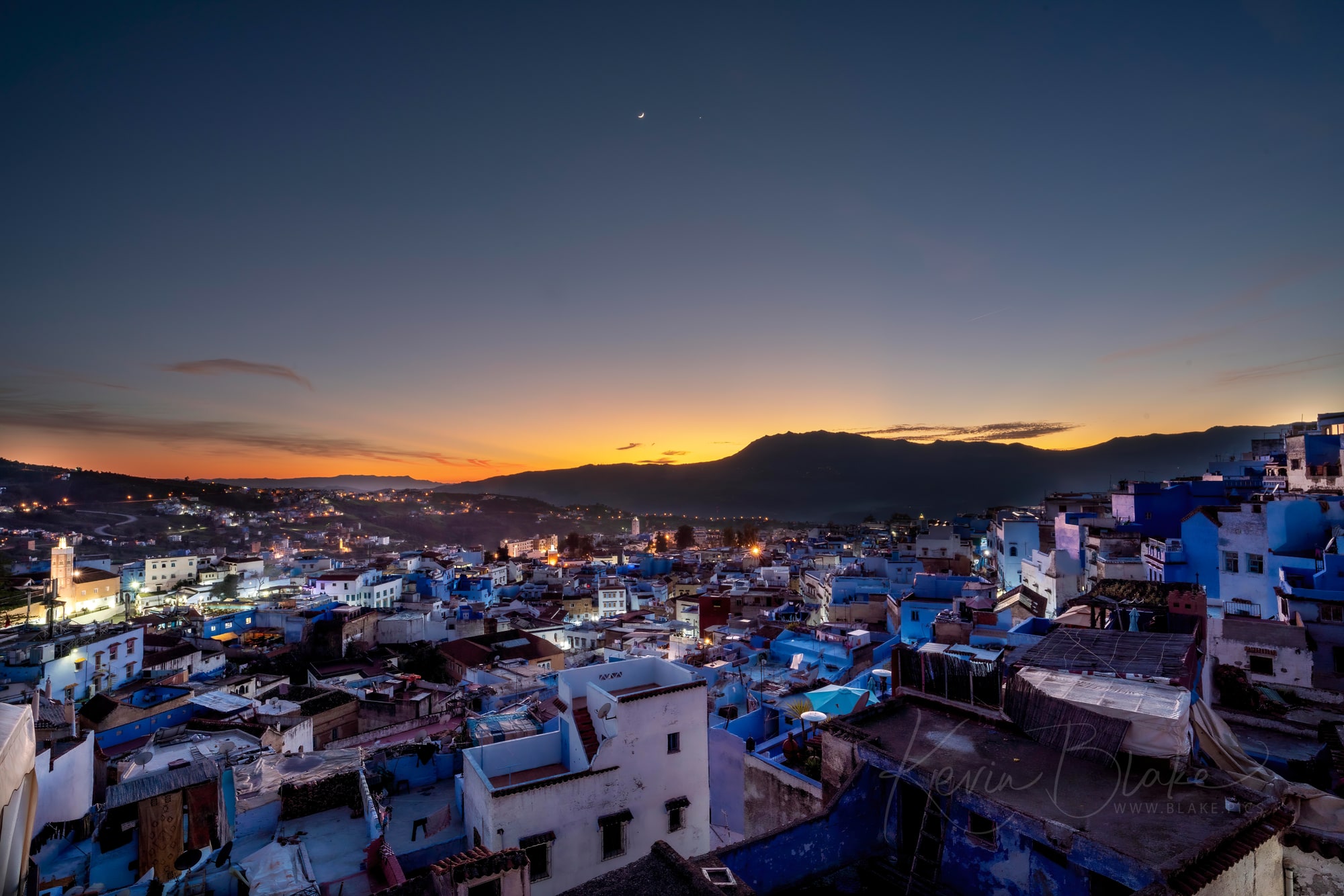 The Moon and Venus visible over the skies of the gorgeous blue city of Chefchauoen, Morocco