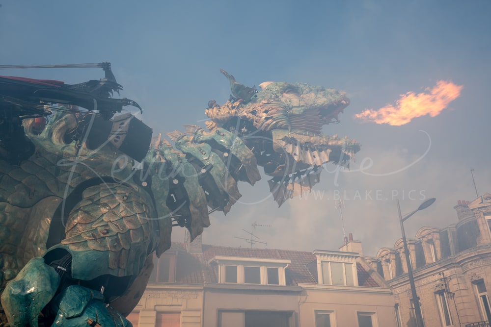 Le Dragon de Calais breathing fire over the rooftops, Calais, France